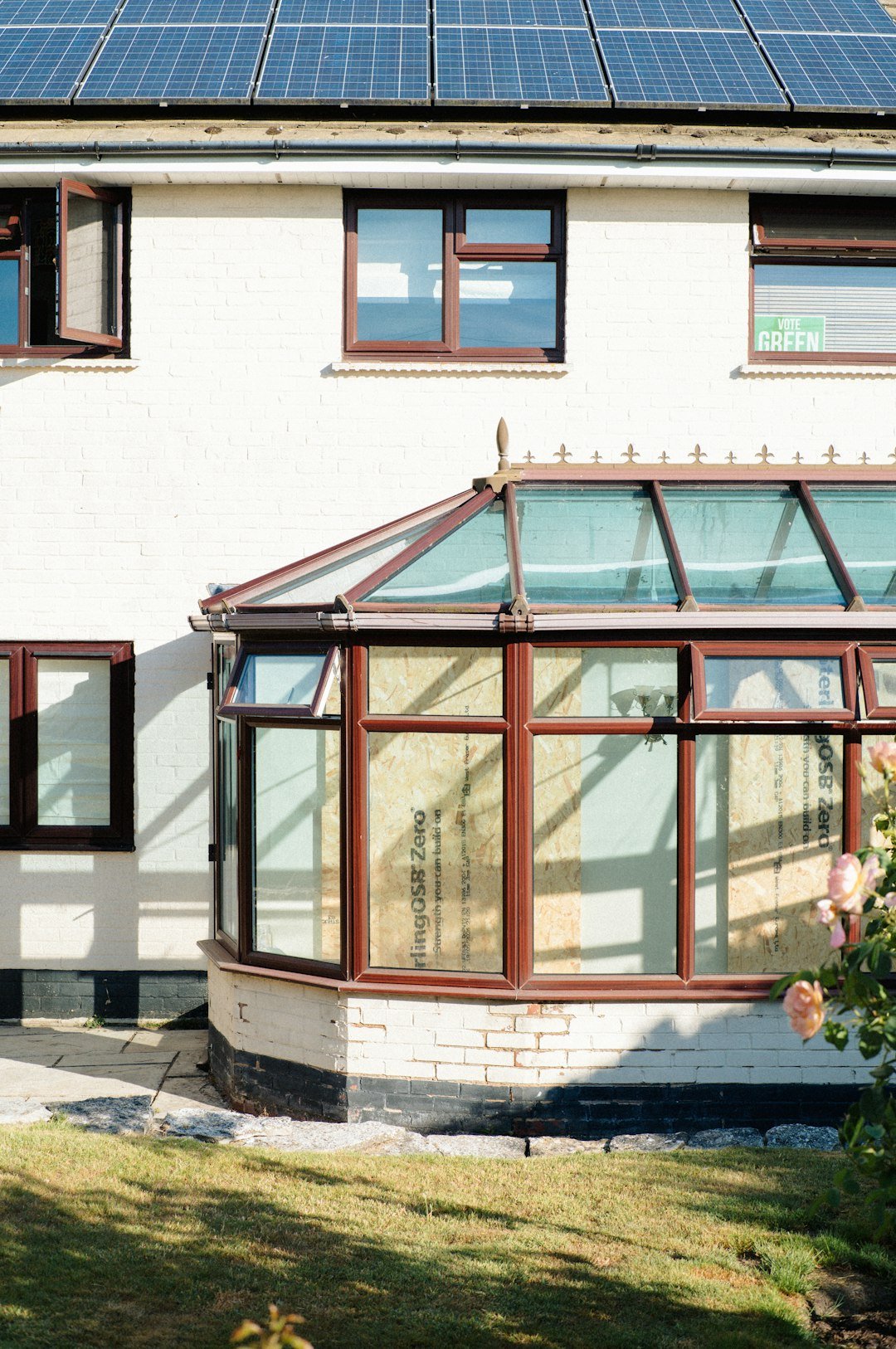 Services white-house-with-solar-panels-and-glass-conservatory-fa6yu7rd4fy